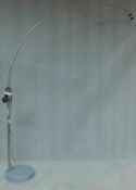 A chromium floor standing arc lamp on marble base, lacks shade. H.220 W.38 D.38cm