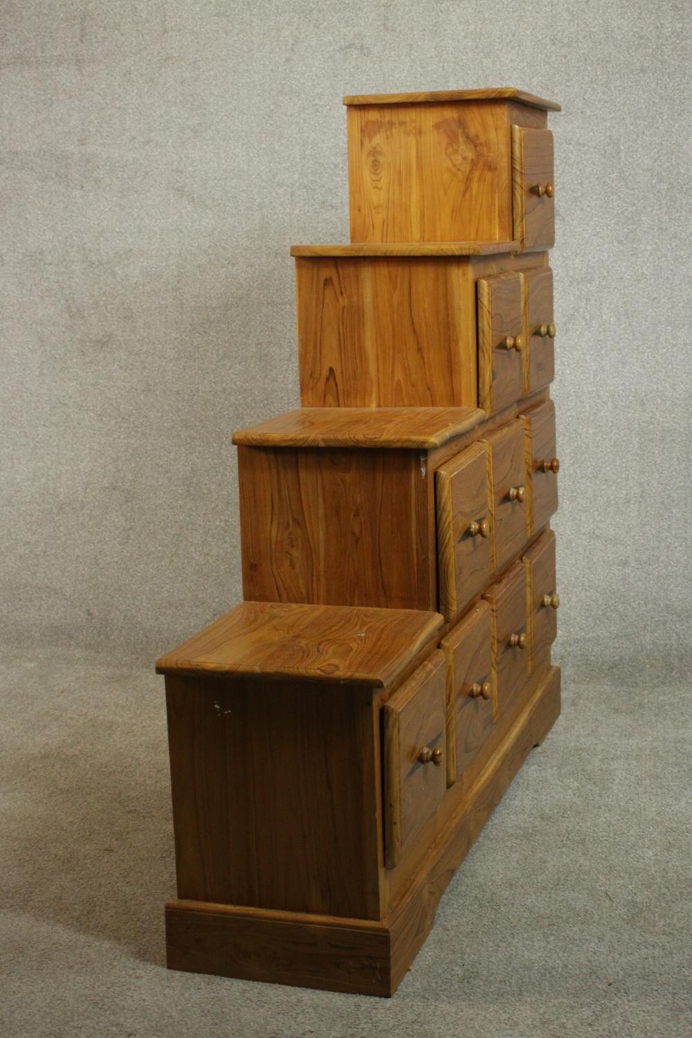 A contemporary pine stepped chest in the style of a Japanese kaidan tansu, with an arrangement of - Image 8 of 9