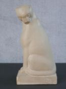 An Alva Museum plaster replica of a seated lion, signed and dated with copyright mark and label to