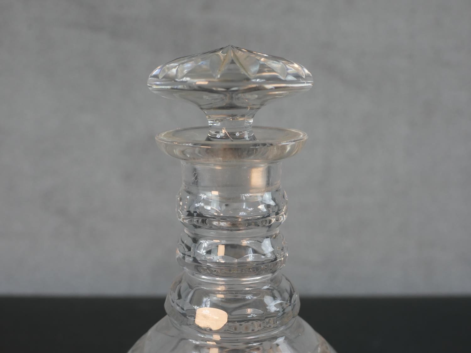 A pair of cut crystal decanters with star cut bases and mushroom stoppers. H.25cm - Image 2 of 5