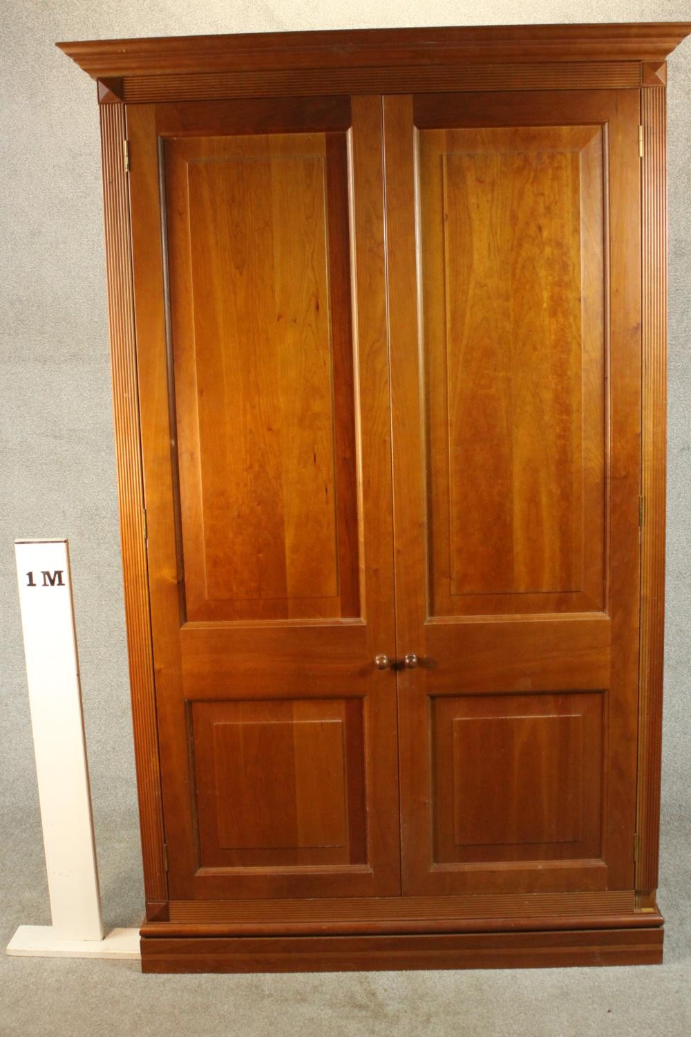 A late 20th century cherrywood wardrobe, with a pair of panelled doors opening to reveal hanging - Image 2 of 13