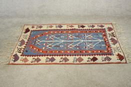 A blue ground hand made Turkish Kelim. L.156 W.106cm.