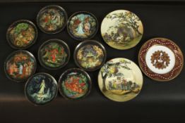 A collection of eleven limited edition ceramic plates, including a set of eight Tianex Russian