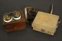 A vintage leather cased Megger circuit testing ohmmeter in green Bakelite, along with a vintage bell