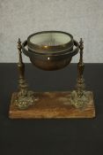 A Victorian brass gimbal mounted ships compass by F.M. Moore of Dublin and Belfast, with cast