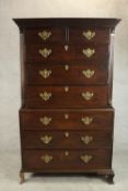 A Georgian mahogany chest on chest with stepped cornice above chamfered upper section on base with