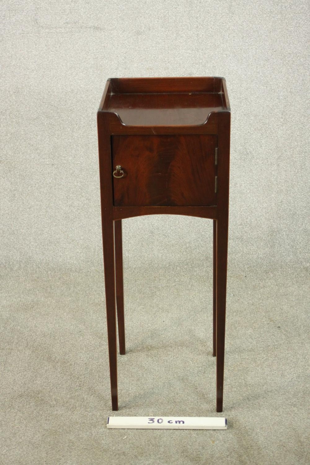 A 19th century mahogany night table, with a gallery top over a cupboard door, on slender tapering - Image 2 of 7