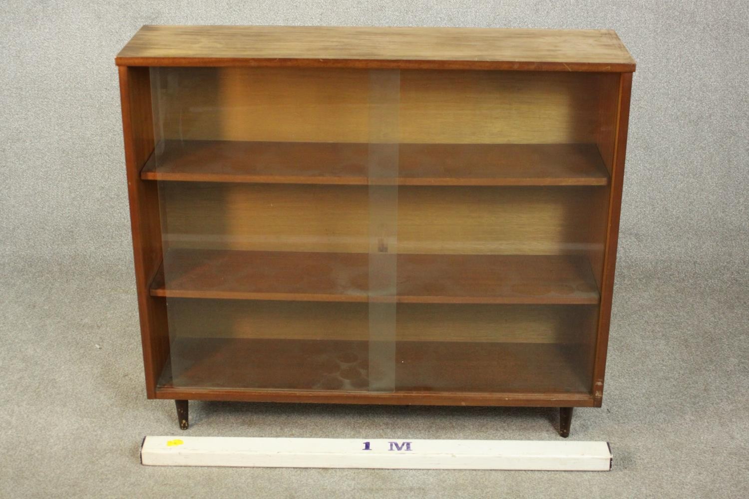 A circa 1960s Jonell bookcase, with a pair of glass sliding doors enclosing shelves, on tapering - Image 2 of 7