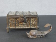 A bronze casket with relief religious figural design on four feet along with a silver plated Roman
