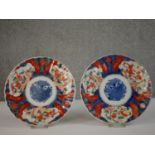 Two 20th century Japanese Imari ceramic plates decorated with goldfish. Diam.22cm