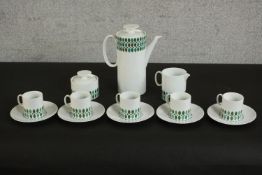 A Thomas porcelain, Germany coffee set to seat five, with printed designs. H.24 W.20 D.10cm. (