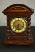 A German H.A.C. walnut mantel clock, made in Wurttemberg, with a fourteen day movement and Roman