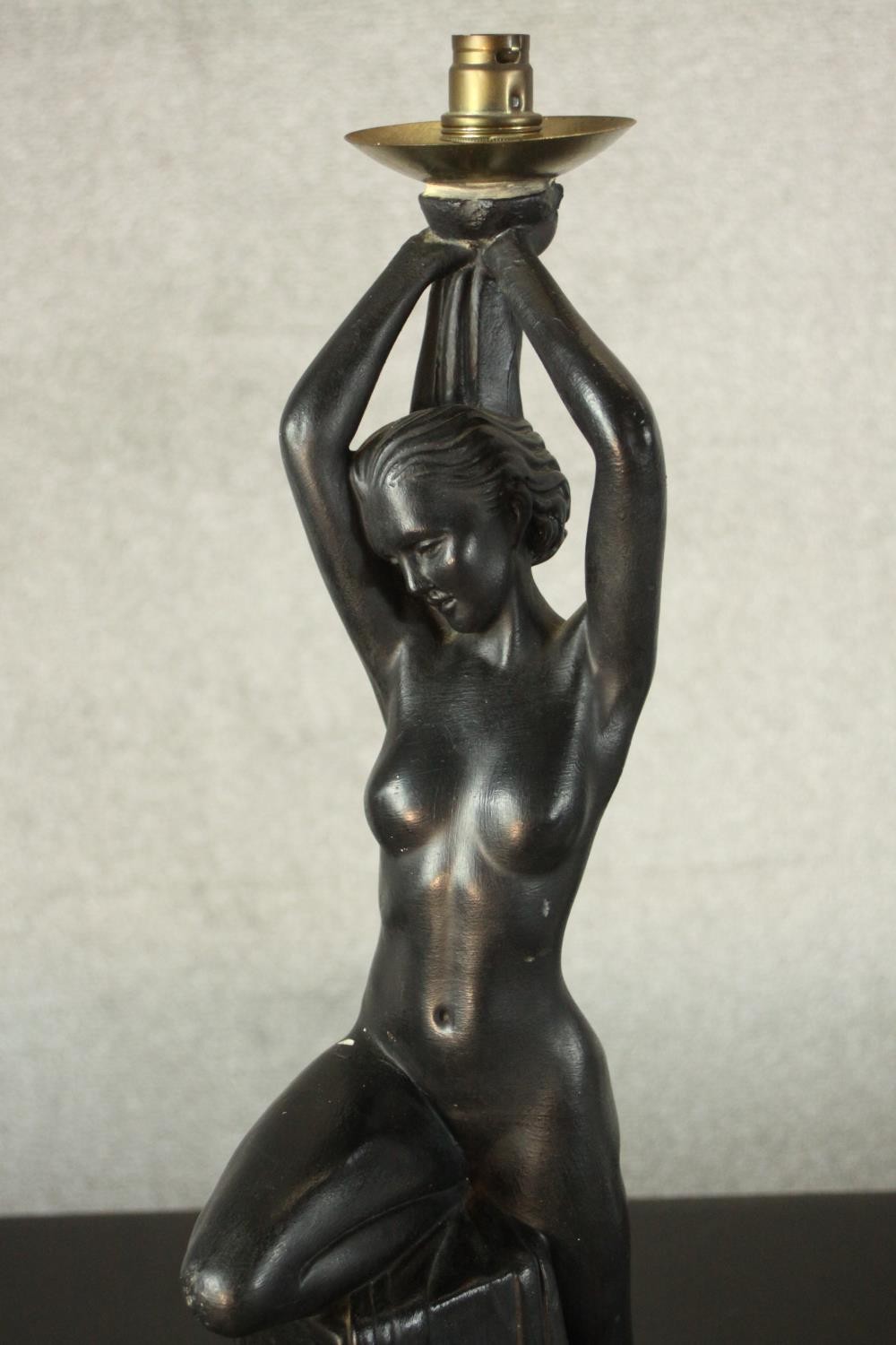 An Art Deco style black painted plaster table lamp in the form of a nude dancer perched on a - Image 4 of 6
