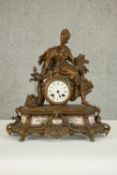 A 19th century French gilt spelter figural design mantle clock with hand painted porcelain panels
