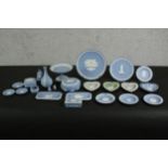 A large collection of Wedgwood Jasperware items, including plates, dishes, boxes, a vase and other