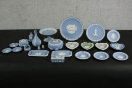 A large collection of Wedgwood Jasperware items, including plates, dishes, boxes, a vase and other