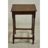 A circa 1910 oak occasional table, the square top with a moulded undulating edge, on barley twist