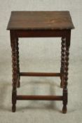 A circa 1910 oak occasional table, the square top with a moulded undulating edge, on barley twist