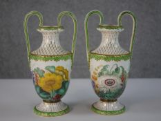 Two 19th century hand painted twin handled porcelain urns. Intricately decorated with irises,
