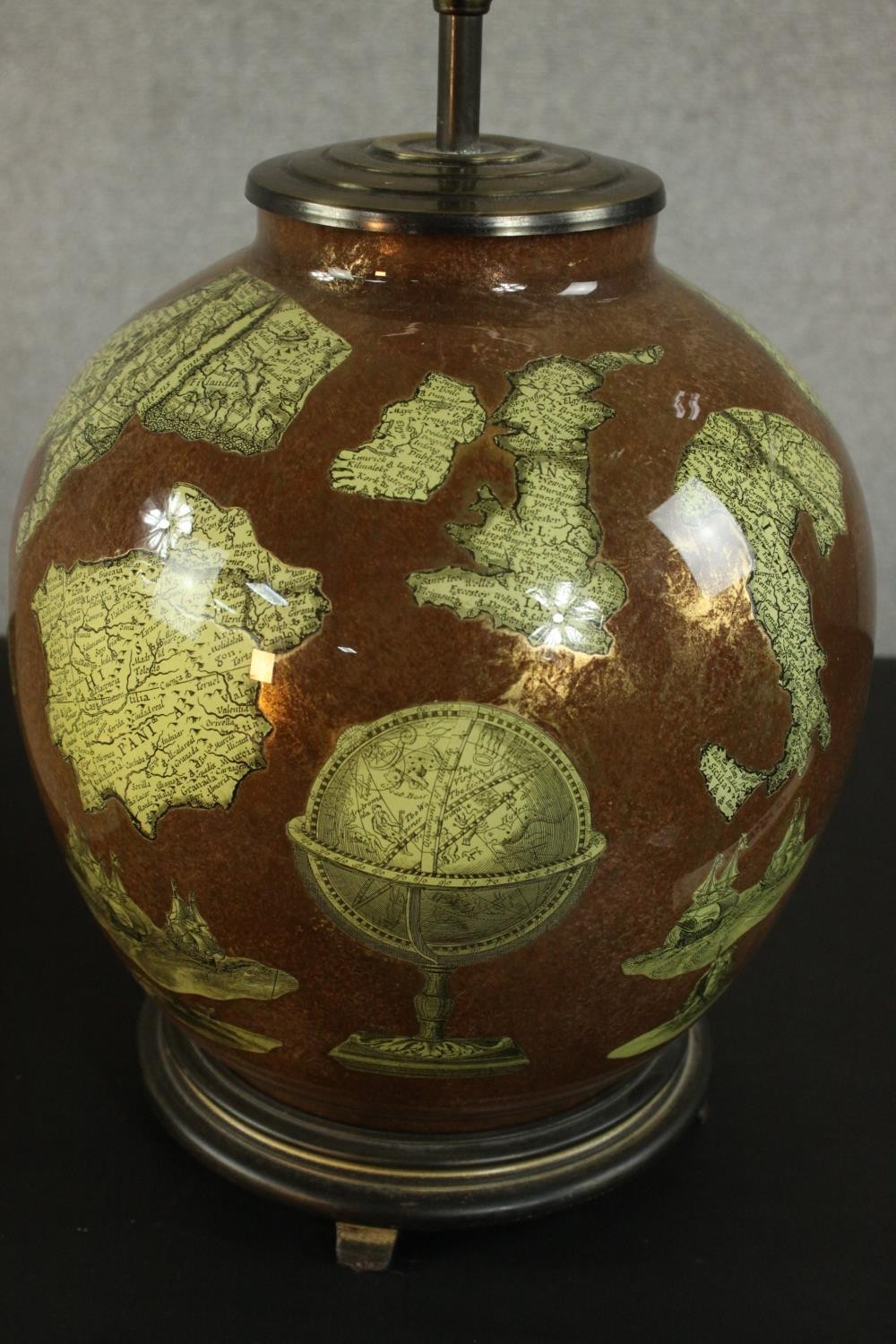 A copper foil and glass table lamp of bulbous form, pasted with sections of map and globes, on a - Image 3 of 5