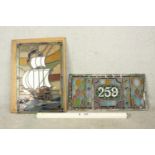 Two early 20th century stained glass panels, one depicting a sailing ship, the other the house