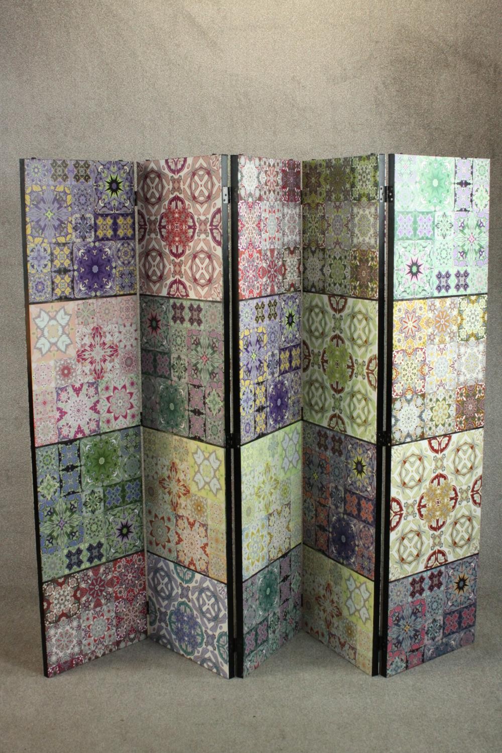 A contemporary five fold screen, each fold with four panels depicting a variety of tile designs in