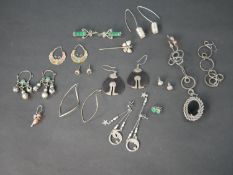 A collection of silver jewellery, including a pair of Chinese enamel butterfly hoop earrings, a pair