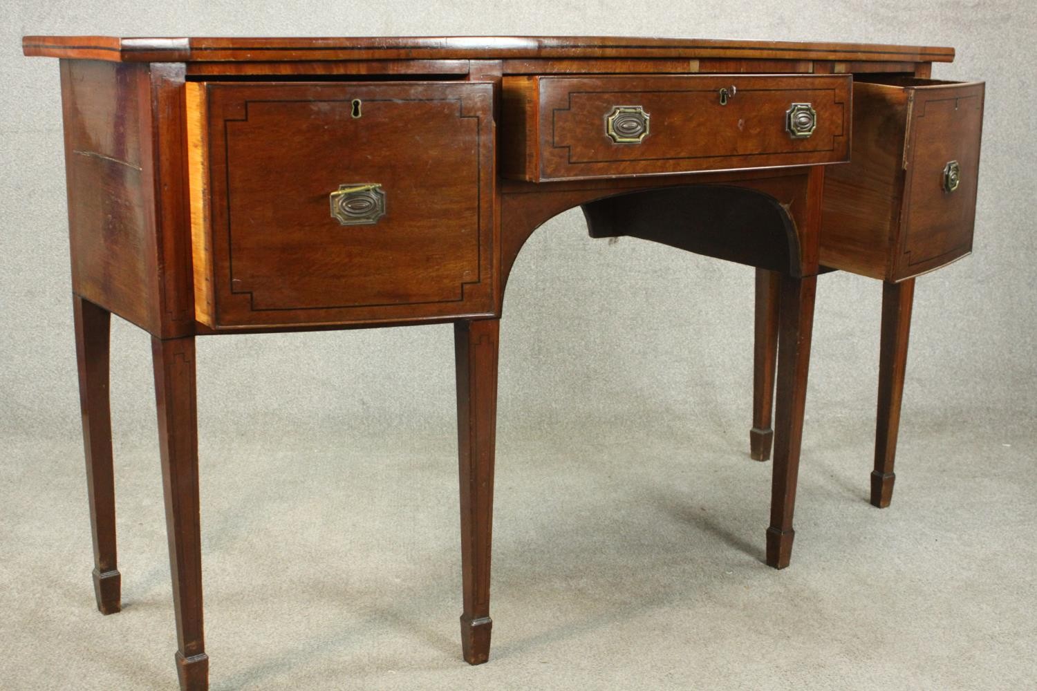 A Regency mahogany bow front sideboard, with a central drawer flanked by two deep drawers on - Image 10 of 13
