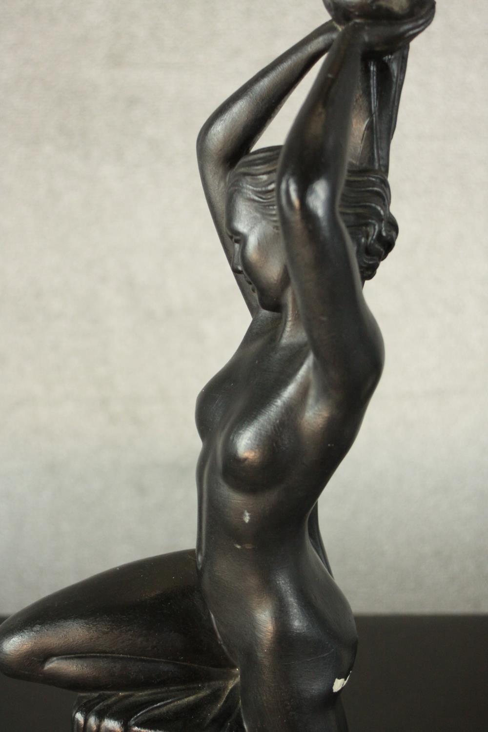 An Art Deco style black painted plaster table lamp in the form of a nude dancer perched on a - Image 3 of 6