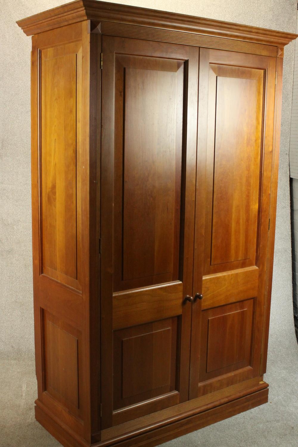 A late 20th century cherrywood wardrobe, with a pair of panelled doors opening to reveal hanging - Image 10 of 13
