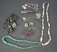 A collection of costume jewellery, including a malachite bead necklace, a broken garnet piece