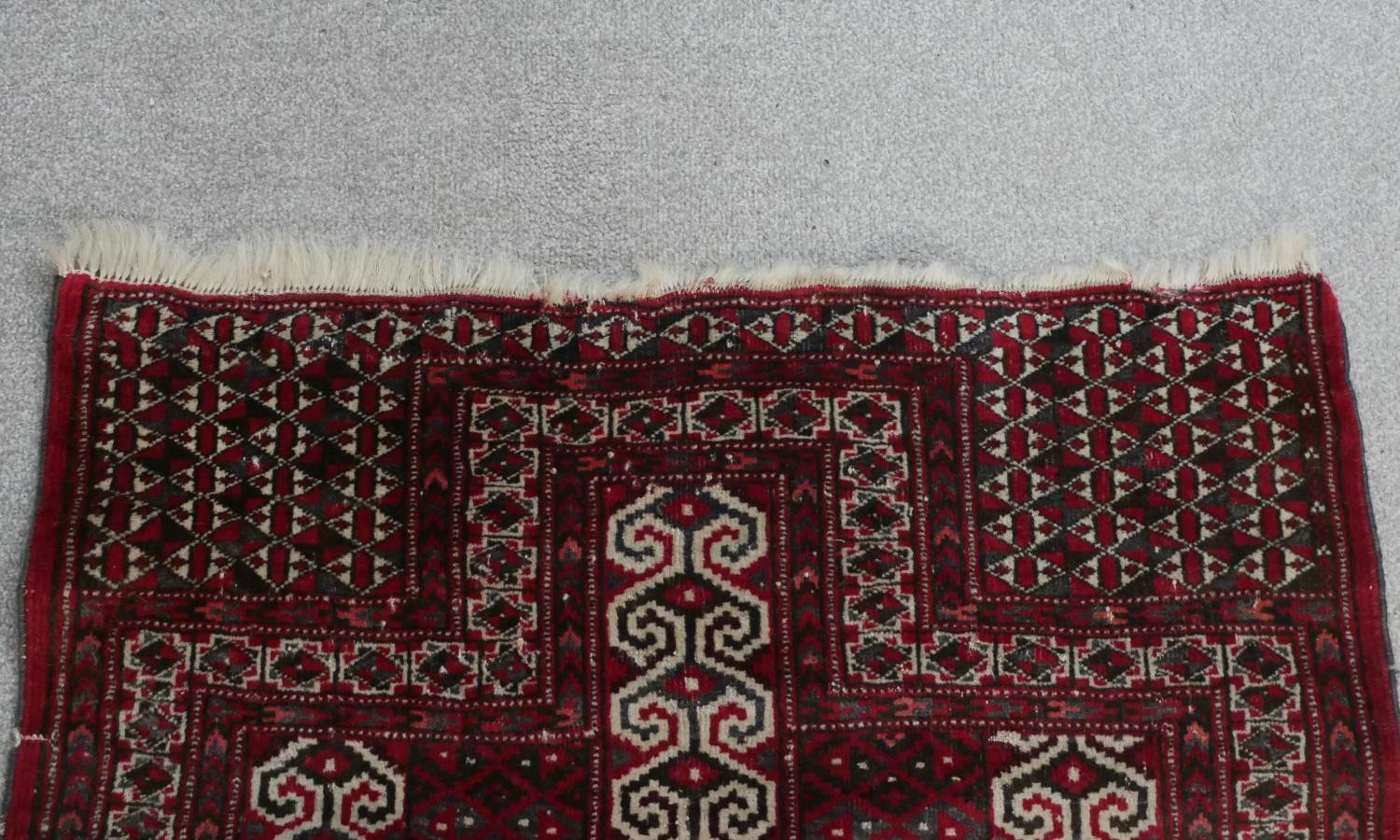 A red ground handmade Persian Turkman rug. L.115 W.100cm - Image 4 of 7