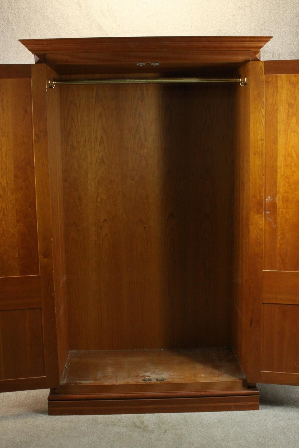 A late 20th century cherrywood wardrobe, with a pair of panelled doors opening to reveal hanging - Image 7 of 13