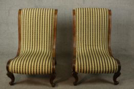 A pair of Victorian walnut slipper chairs, with striped upholstery and on carved scrolling legs.