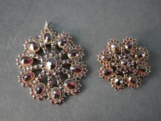 A large late 19th century Bohemian garnet openwork cluster pendant, in the form of a eight