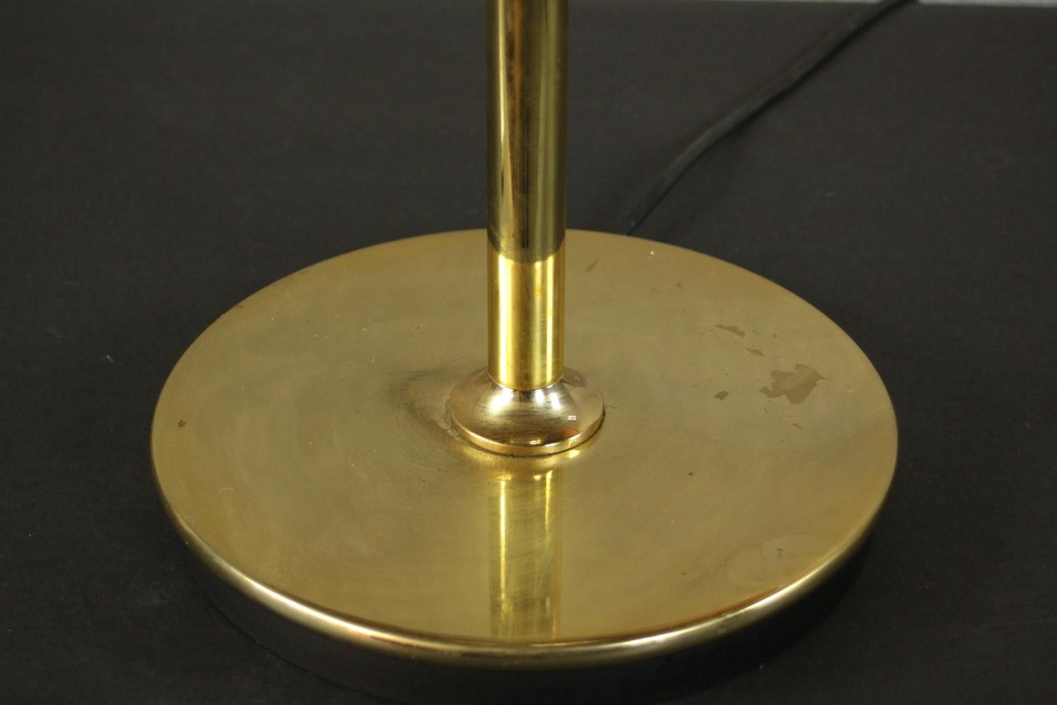 A contemporary brass table lamp, with a slender stem and a circular base, with a black shade. H.60 - Image 3 of 5