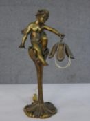 A gilded Art Nouveau cherub and flower design brass table lamp. H.33 Diam.11cm