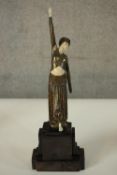 After Chiparus, an Art Deco style resin figure of a dancer 'Footsteps' on a marble effect base. H.42