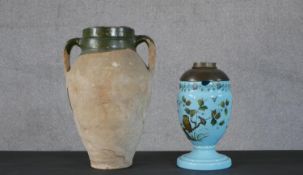 A terracotta internally glazed twin handled amphora along with a Victorian opaque blue glass oil