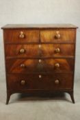 An early 19th century mahogany chest of drawers, with two short over three long graduated drawers