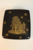 A Japanese gilded and lacquered Buddhistic lion Maki-e Suzuribako Inkstone writing box, containing