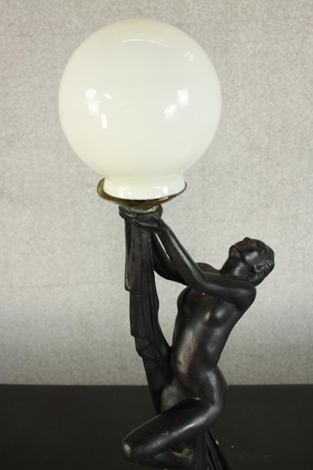 An Art Deco style black resin table lamp in the form of a nude dancer with white glass globe - Image 3 of 6