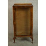 A circa 1930s walnut display cabinet, with a glazed door and sides, on cabriole legs. H.114 W.57 D.