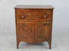 A Georgian mahogany bow fronted commode cabinet with faux draw on swept bracket feet. H.70 W.60 D.