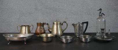 A collection of metal ware, including a vintage soda siphon, a silver plated engraved tea set, a