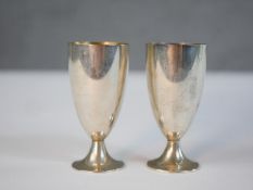 A pair of boxed Tiffany and Co sterling silver stemmed cordial glasses, gilded interiors and