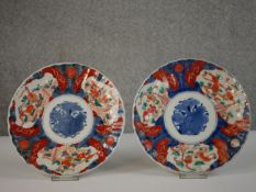 Two 20th century Japanese Imari ceramic plates decorated with goldfish. Diam.22cm