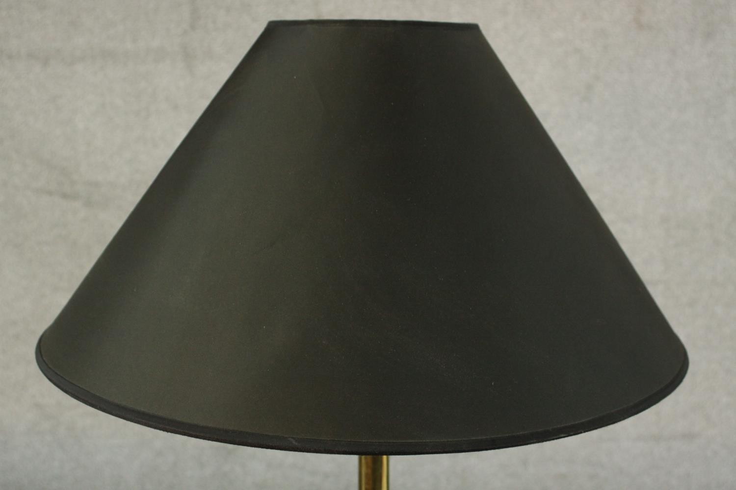 A contemporary brass table lamp, with a slender stem and a circular base, with a black shade. H.60 - Image 5 of 5