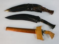 A Malay kris dagger, together with two Gurkha kukri knives. L.45cm (largest)