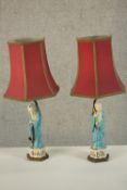 Two Qing period hand painted porcelain immortal figures converted into table lamps on brass bases